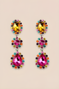 Colorful gemstone earrings on a beige background