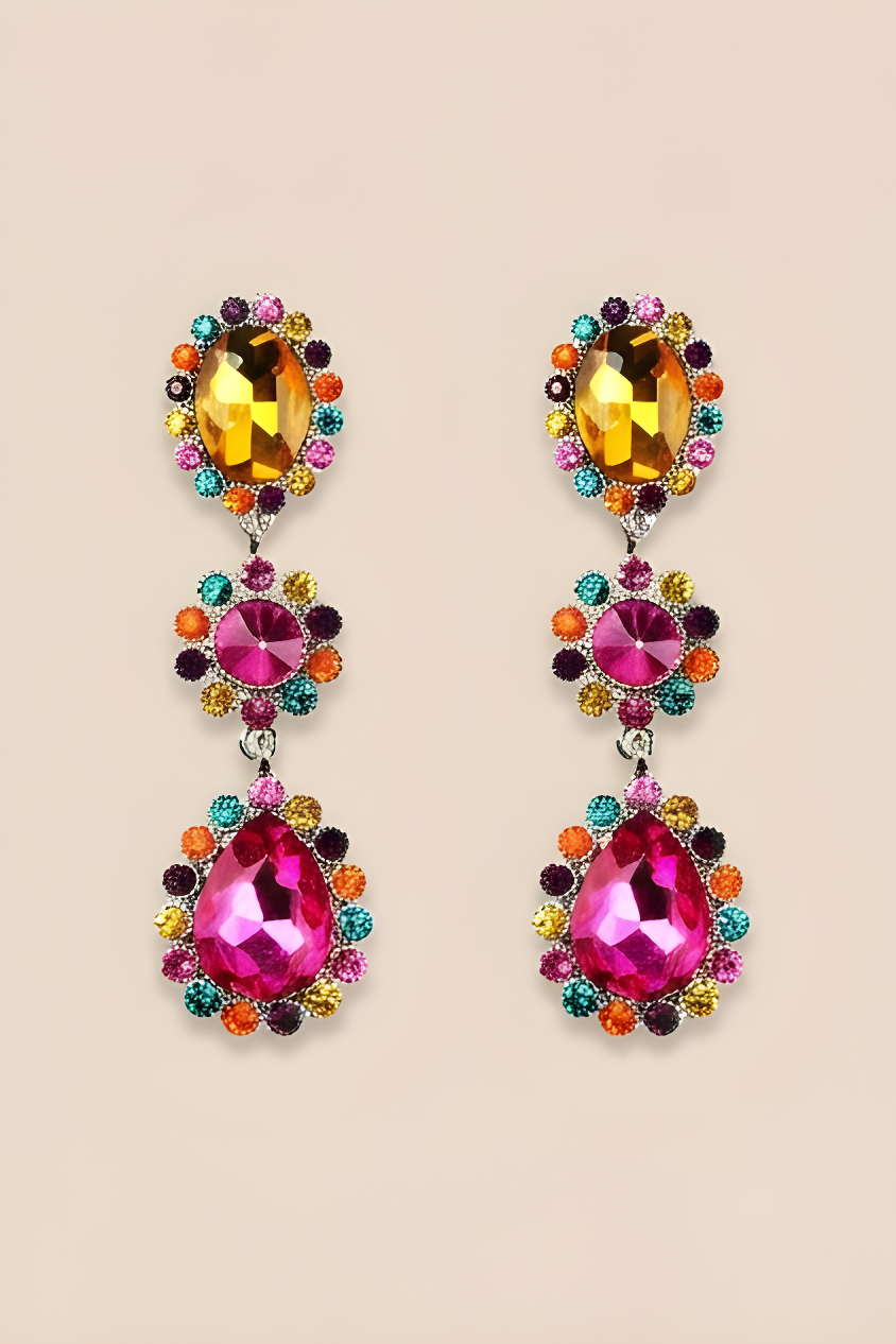 Colorful gemstone earrings on a beige background