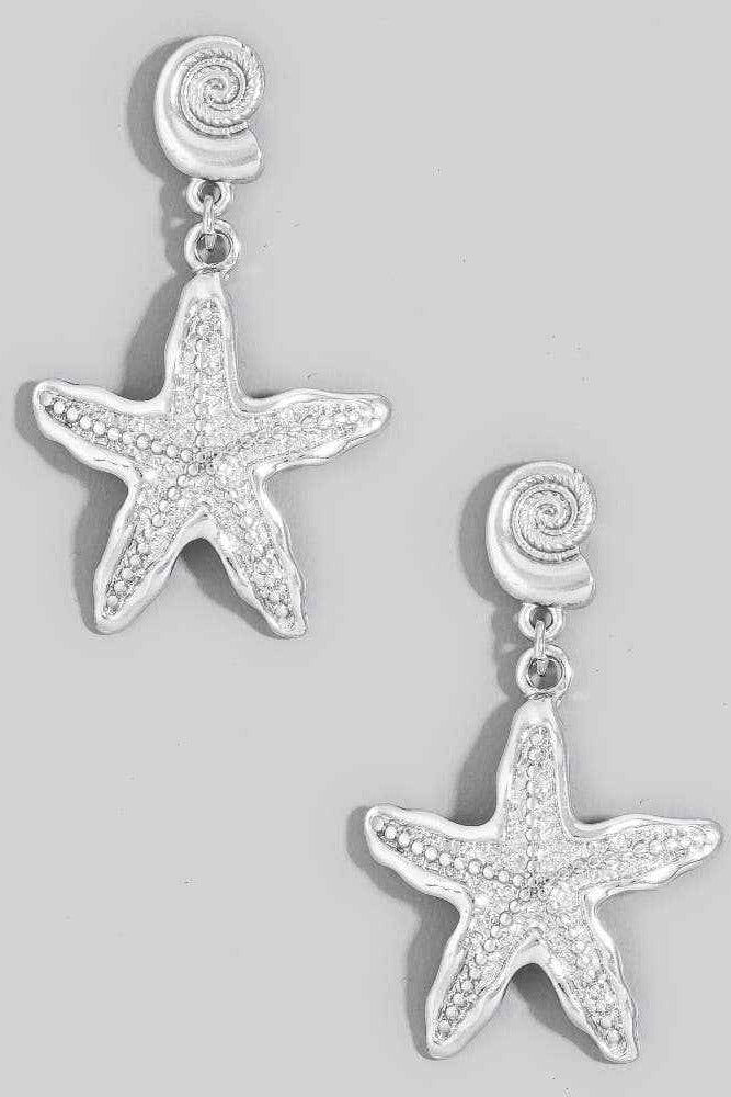 Starfish-shaped earrings on a light gray background