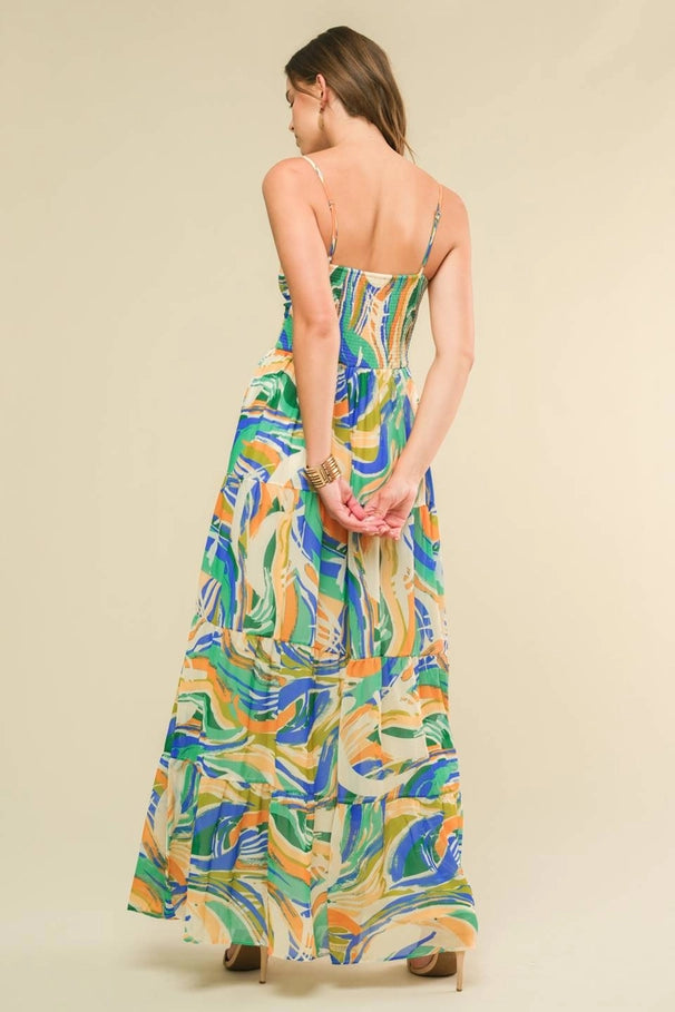 Woman wearing a colorful patterned dress on a beige background